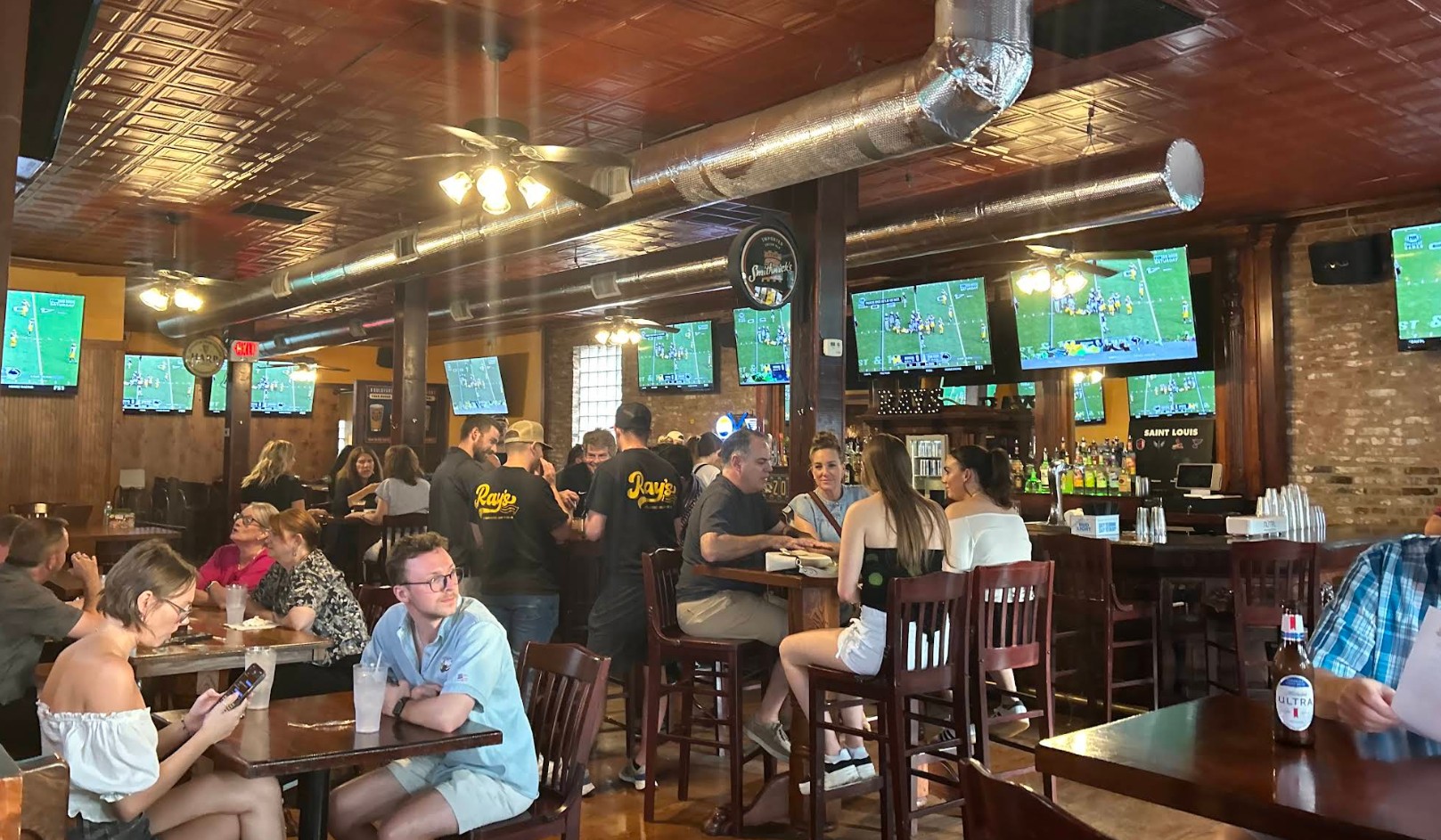 Ray's SportsHouse wall-to-wall 54+ HD screens and packed bar in Soulard